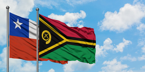 Chile and Vanuatu flag waving in the wind against white cloudy blue sky together. Diplomacy...