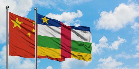 China and Central African Republic flag waving in the wind against white cloudy blue sky together. Diplomacy concept, international relations.