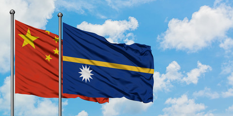 China and Nauru flag waving in the wind against white cloudy blue sky together. Diplomacy concept,...