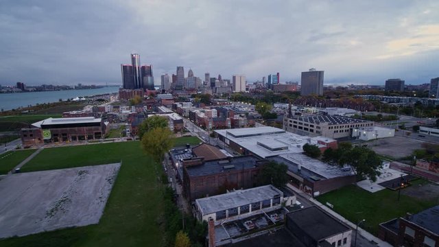 Detroit Michigan Aerial v138 Crossing into Rivertown Warehouse district with downtown skyline views - October 2017