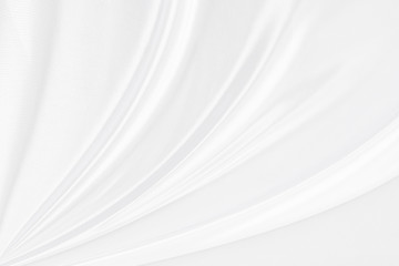 Background satin fabric white gray textures luxurious shiny that is abstract silver silk cloth  with patterns soft wave blur silky beautiful.