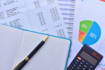 Pen, calculator and account reports. Business and finance concepts