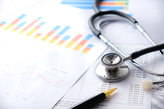 Stethoscope with Pen, Charts and Graphs, Finance, Account, Statistics, Investment, Analytic Research Data Economy Spreadsheet and Business Company Concept