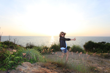 Portraits of young women wearing black glasses before the sun sets at Kaoh Samet, Thailand.