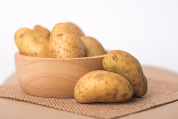 Small potatoes placed on a white background.