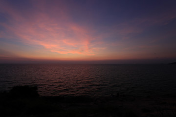 View at the cliffs while the sun sets at the beach, Ko Samet, Thailand