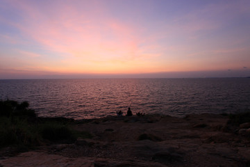 Naklejka na ściany i meble View at the cliffs while the sun sets at the beach, Ko Samet, Thailand