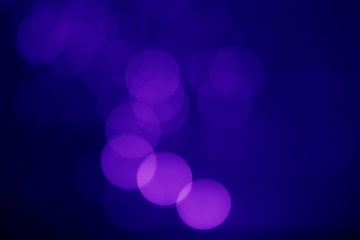Abstract blue bokeh on a dark background