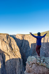 Woman Doing Handstands and Looking over the Black Canyon of the Gunnison