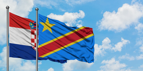 Croatia and Congo flag waving in the wind against white cloudy blue sky together. Diplomacy concept, international relations.