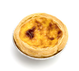 egg tart in aluminum foil cup isolated on white background