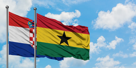 Croatia and Ghana flag waving in the wind against white cloudy blue sky together. Diplomacy concept, international relations.