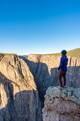 Woman Doing Handstands and Looking over the Black Canyon of the Gunnison