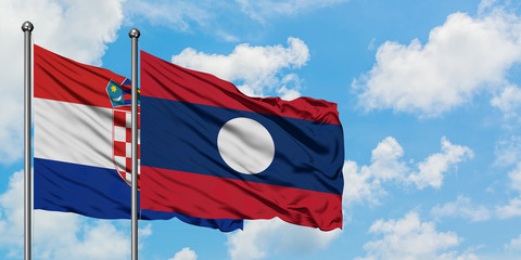 Croatia and Laos flag waving in the wind against white cloudy blue sky together. Diplomacy concept, international relations.