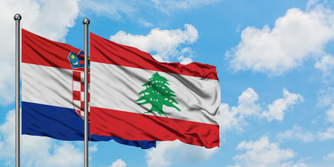 Croatia and Lebanon flag waving in the wind against white cloudy blue sky together. Diplomacy concept, international relations.