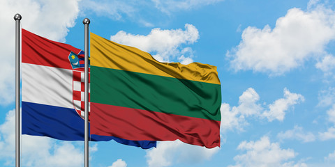 Croatia and Lithuania flag waving in the wind against white cloudy blue sky together. Diplomacy concept, international relations.