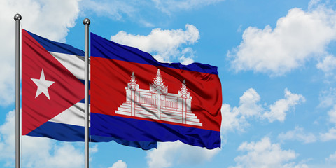 Cuba and Cambodia flag waving in the wind against white cloudy blue sky together. Diplomacy concept, international relations.