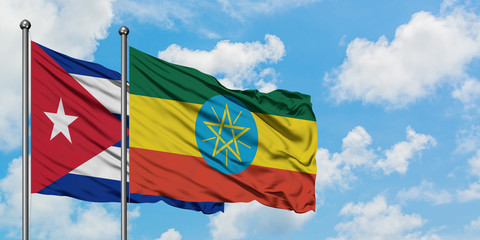 Cuba and Ethiopia flag waving in the wind against white cloudy blue sky together. Diplomacy concept, international relations.