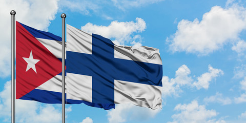 Cuba and Finland flag waving in the wind against white cloudy blue sky together. Diplomacy concept,...