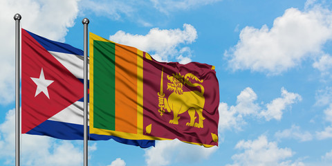Cuba and Sri Lanka flag waving in the wind against white cloudy blue sky together. Diplomacy...