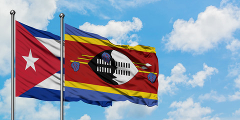 Cuba and Swaziland flag waving in the wind against white cloudy blue sky together. Diplomacy...