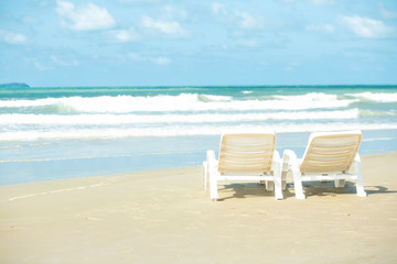 Fototapeta na wymiar Two Beach Chairs on beach vacation time