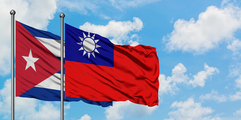 Cuba and Taiwan flag waving in the wind against white cloudy blue sky together. Diplomacy concept, international relations.