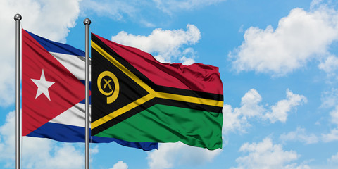 Cuba and Vanuatu flag waving in the wind against white cloudy blue sky together. Diplomacy concept, international relations.