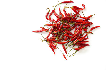 Fototapeta premium A pile of bright red Thai bird chiles scattered on an isolated white background with copy space