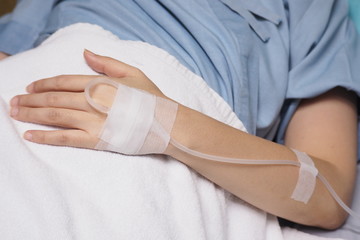 The hand of a patient with a saline solution.