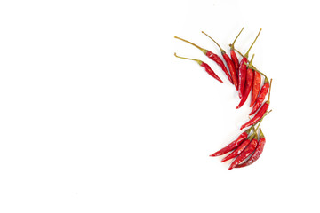 Bright red Thai bird chiles isolate on a white background with copy space
