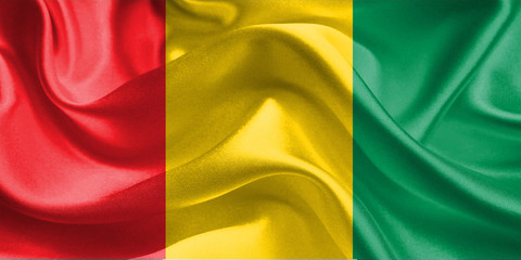 Guinea Flag. Flag of Guinean. Waving Flags. 3D Realistic Background Illustration in Silk Fabric Texture