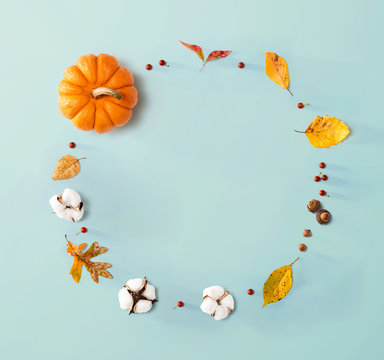 Autumn theme with orange pumpkin - flat lay