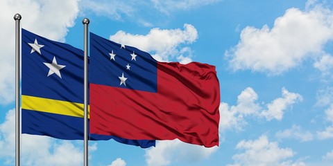 Curacao and Samoa flag waving in the wind against white cloudy blue sky together. Diplomacy concept, international relations.