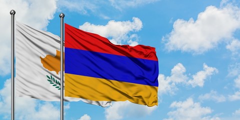 Cyprus and Armenia flag waving in the wind against white cloudy blue sky together. Diplomacy concept, international relations.