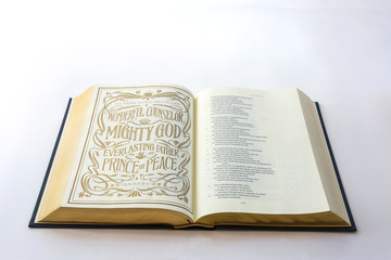 Obraz premium Open holy bible Isaiah isolated on white background