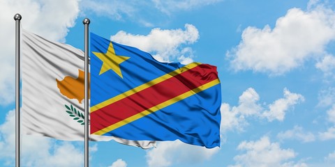 Cyprus and Congo flag waving in the wind against white cloudy blue sky together. Diplomacy concept, international relations.