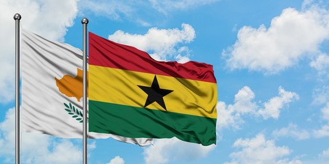 Cyprus and Ghana flag waving in the wind against white cloudy blue sky together. Diplomacy concept, international relations.