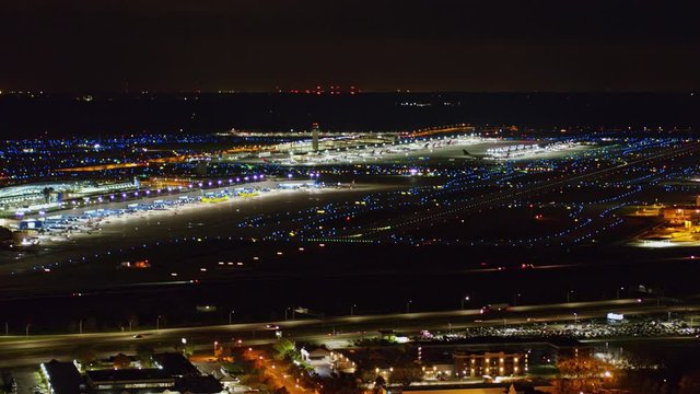 Detroit Michigan Aerial v164 Slow nighttime detail of Delta terminal and runway - October 2017