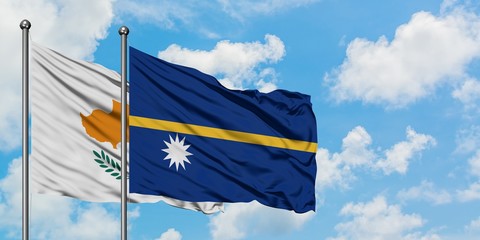 Cyprus and Nauru flag waving in the wind against white cloudy blue sky together. Diplomacy concept,...