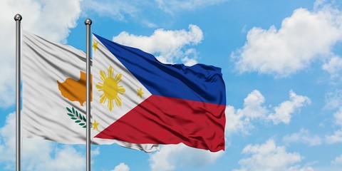 Cyprus and Philippines flag waving in the wind against white cloudy blue sky together. Diplomacy concept, international relations.