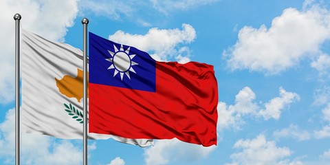 Cyprus and Taiwan flag waving in the wind against white cloudy blue sky together. Diplomacy concept, international relations.