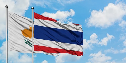 Cyprus and Thailand flag waving in the wind against white cloudy blue sky together. Diplomacy concept, international relations.