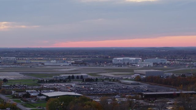 Detroit Michigan Aerial v168 Slow panning airport cityscape with pink sky - October 2017