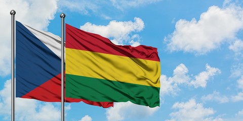 Czech Republic and Bolivia flag waving in the wind against white cloudy blue sky together. Diplomacy concept, international relations.