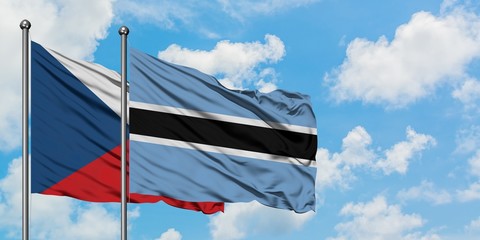 Czech Republic and Botswana flag waving in the wind against white cloudy blue sky together. Diplomacy concept, international relations.