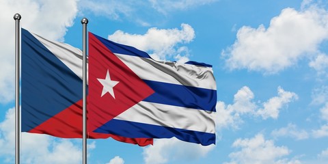 Czech Republic and Cuba flag waving in the wind against white cloudy blue sky together. Diplomacy concept, international relations.
