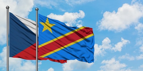 Czech Republic and Congo flag waving in the wind against white cloudy blue sky together. Diplomacy concept, international relations.