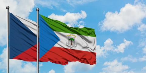 Czech Republic and Equatorial Guinea flag waving in the wind against white cloudy blue sky together. Diplomacy concept, international relations.