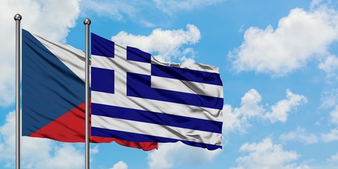 Czech Republic and Greece flag waving in the wind against white cloudy blue sky together. Diplomacy concept, international relations.